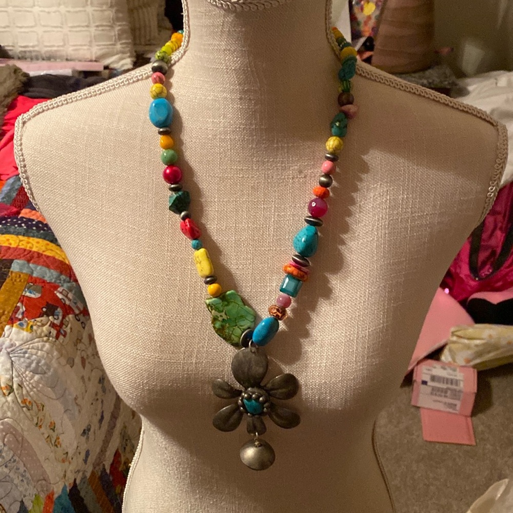 Art by Amy multi colored stone with a bronze flower drop with turquoise.